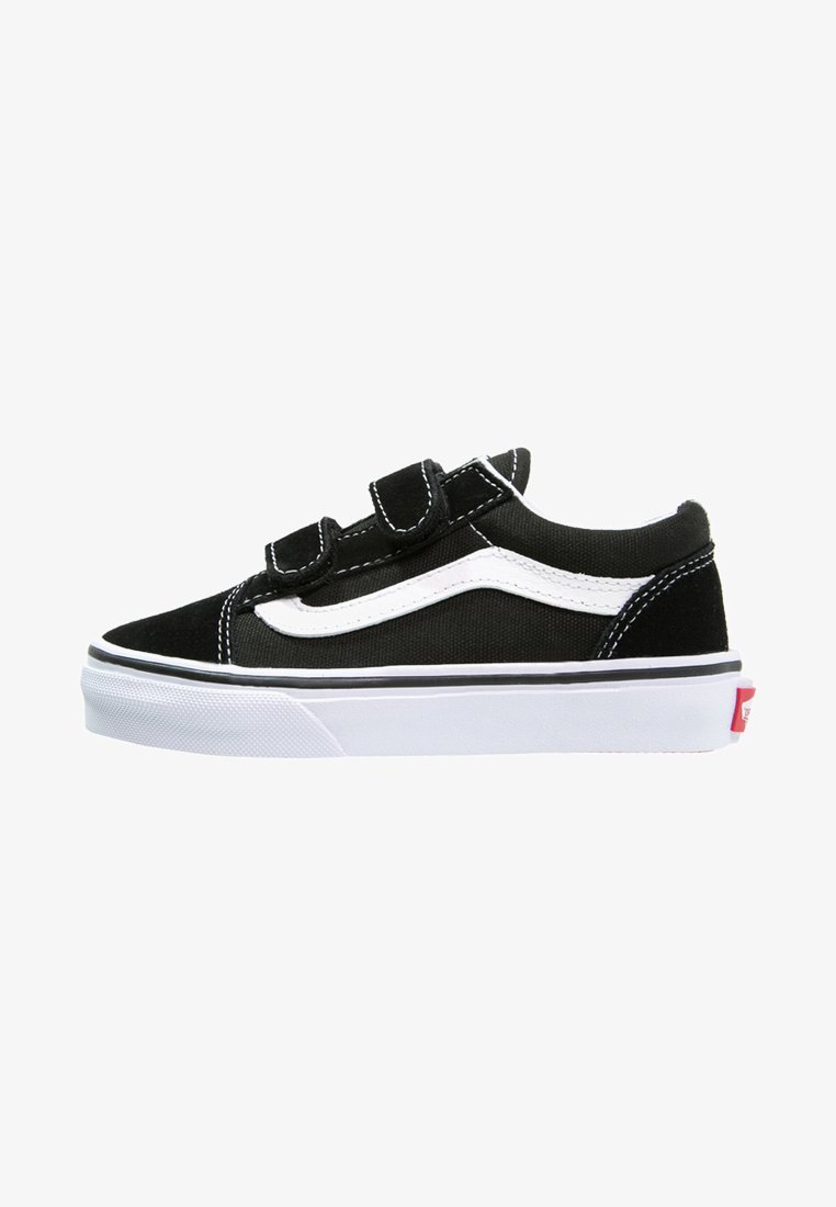 Black canvas sneakers with white accents, Velcro straps, and a rounded toe. Features a white rubber sole and contrasting black stitching.