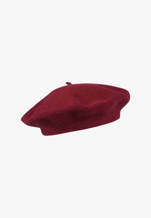 Burgundy wool beret with a rounded shape, soft texture, and a small top loop. Designed for a snug fit on the head.