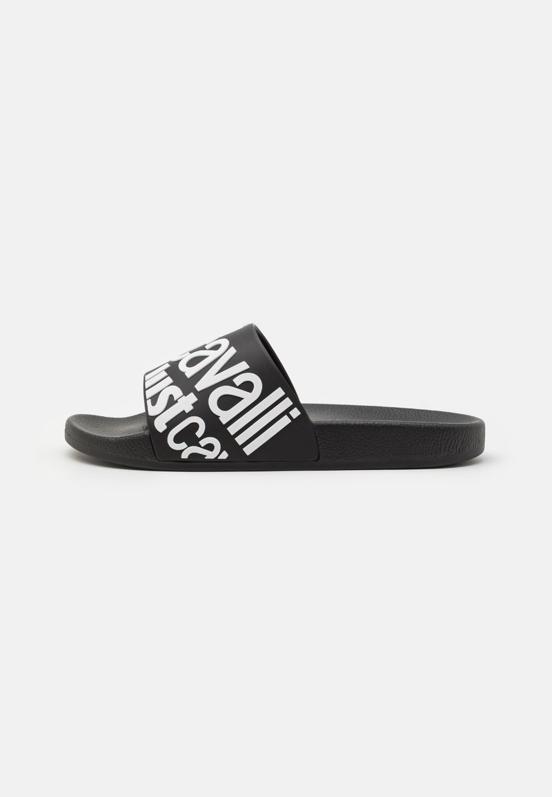 Black slide sandal featuring a wide strap with bold white text. The sole is textured for grip, designed for casual wear.