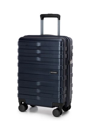 Hard-shell suitcase in dark navy with textured horizontal stripes, retractable handle, four black wheels, and a lockable zipper.
