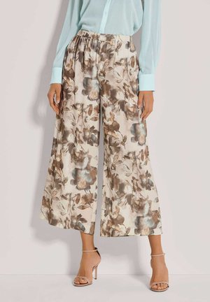 Blumenweite Hosen aus leichtem Stoff. Beiger Grundton mit braunen und blauen Blumenmustern. Elastischer Bund für Komfort, mit lockerer Passform.