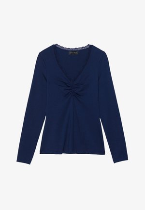 Navy long-sleeve top with a V-neck, featuring lace trim, gathered front detail, and a relaxed fit. Smooth, soft fabric texture.