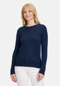 Maglione a maniche lunghe blu navy con scollatura rotonda, orlo e polsini a coste, realizzato in un morbido tessuto a maglia testurizzato.