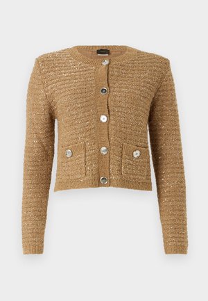 Cropped, beige cardigan with a textured knit and subtle shimmer. Features silver buttons and two front pockets. Round neckline.