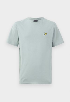 T-shirt de algodão azul claro com decote redondo e mangas curtas. Apresenta um pequeno logótipo bordado amarelo no lado esquerdo do peito.