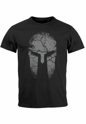 Schwarzes T-Shirt aus Baumwolle mit einem rissigen grauen Spartanhelmen-Grafik, die zentral auf der Vorderseite ist. Kurze Ärmel und standard Rundhalsausschnitt.