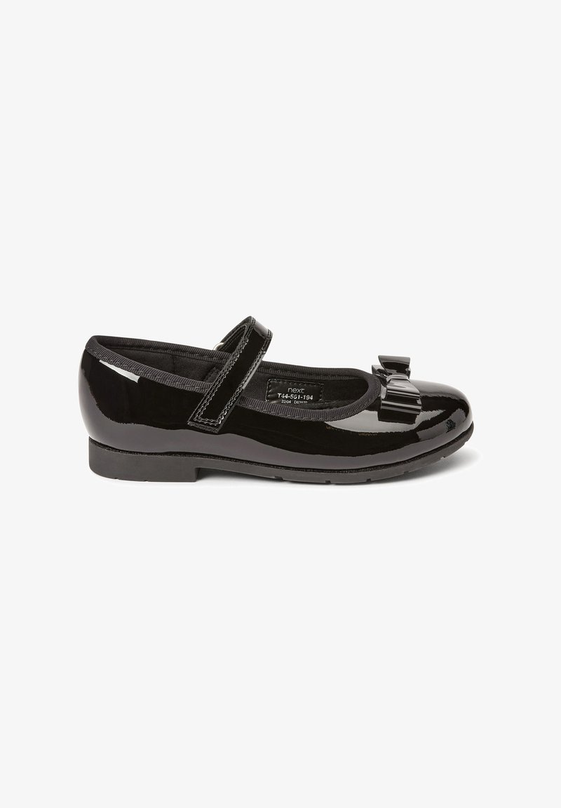 Black patent leather Mary Jane flat shoe with a rounded toe, single strap across the top, and a bow detail on the front.
