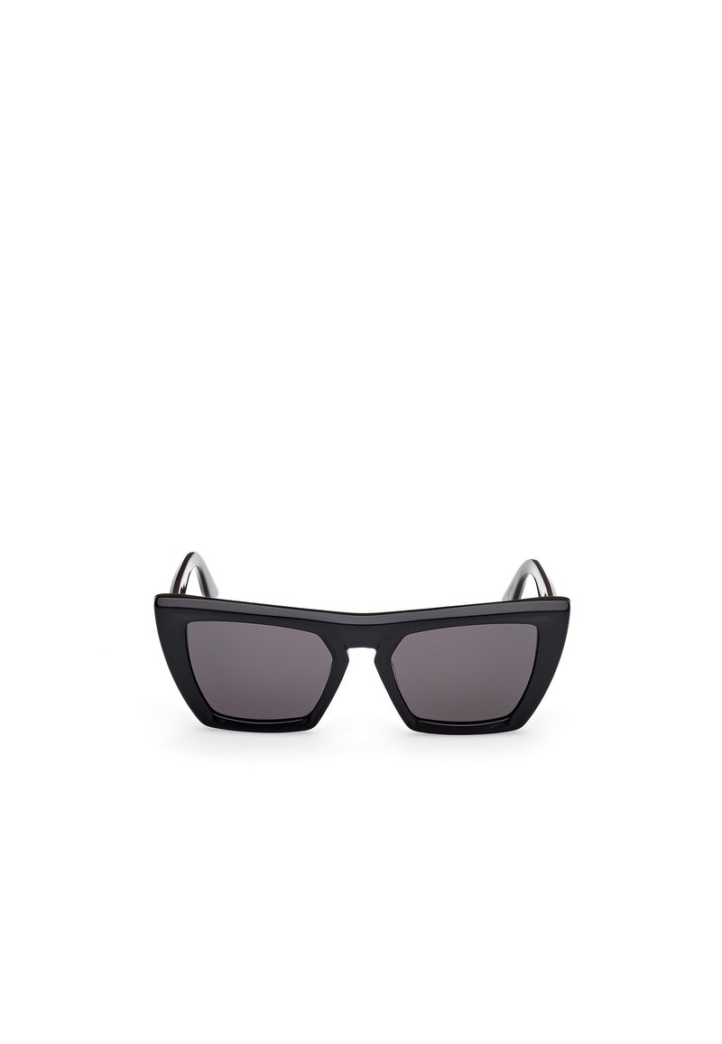 Black cat-eye sunglasses with dark lenses, featuring a thick, matte plastic frame and angular temples, designed with a minimalist aesthetic.