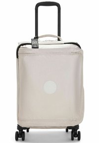 Hard-shell suitcase in light beige fabric. Features a retractable handle, four wheels, a zipper closure, and a round logo detail on the front.