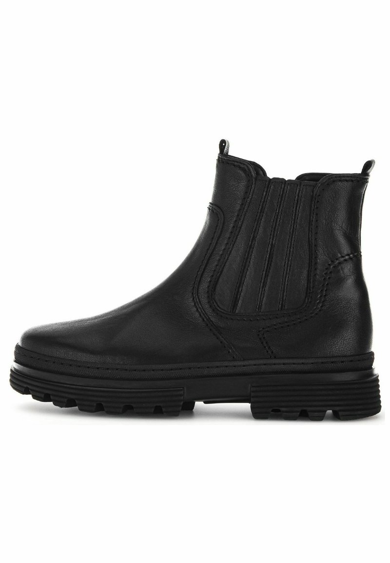 Bottine noire en cuir avec panneaux latéraux élastiques, languettes de traction au talon et sur la languette, et semelle épaisse en caoutchouc rainurée.
