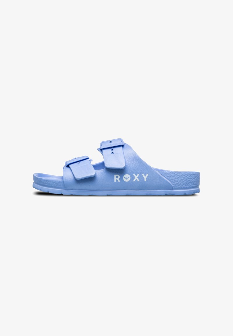 Blauwe slide sandaal met twee verstelbare banden, textuur bovenkant, platte zool en witte "ROXY" logo. Gemaakt van lichtgewicht, duurzaam materiaal.