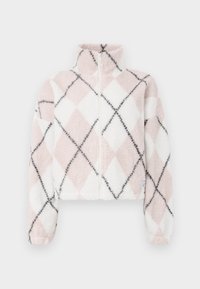 Veste polaire douce zippée avec col haut, présentant un motif losanges rose et blanc avec des lignes diagonales noires.