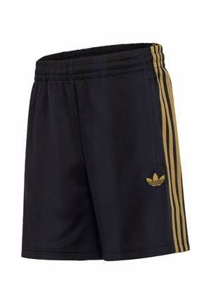 Musta urheilushortsit, joissa joustava vyötärö, kultaiset sivuraidat ja kultainen Adidas-treisikukkalogo vasemmassa reidessä.