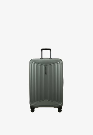 Medium-sized gray hard-shell suitcase with telescoping handle and four spinner wheels, featuring a ridged rectangular design on the front.