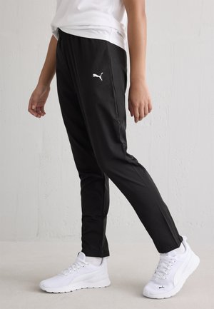 TAD WOVEN TAPERED PANTS UNISEX - Verryttelyhousut - black