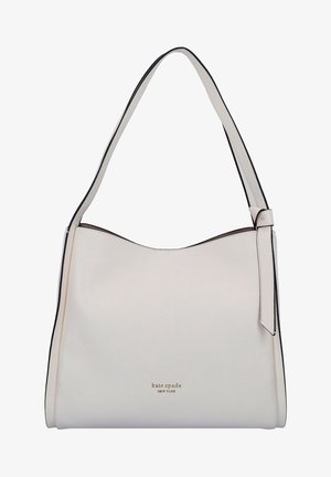Sac à épaule en cuir blanc avec une bandoulière simple, texture subtile du grain et petit logo doré "kate spade NEW YORK" au centre avant.