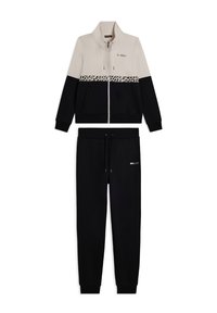 Giacca da track con zip beige e nera con striscia leopardata e pantaloni jogger neri coordinati con tasche e cordino.