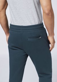 Chiemsee MIT PRINT - Tracksuit bottoms - total eclipse