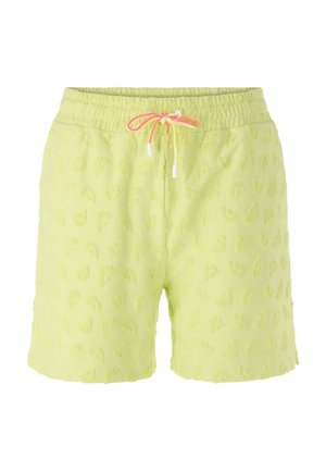 Hellgrüne Shorts mit elastischem Bund, rosa Kordel und eingeprägten halbkreisförmigen Mustern, die den Stoff bedecken.