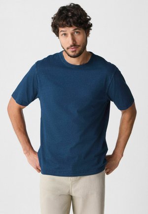 Navy blue short-sleeve crew neck t-shirt with a relaxed fit, featuring a smooth texture and visible stitching details.