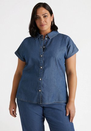 Dunkelblaue Jeanshemd mit Kragen, kurz gerollten Ärmeln, Knopfleiste und dezenten Nähdetails.