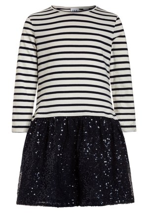 Robe à manches longues avec un haut à rayures horizontales blanches et noires et une jupe en tulle noire à paillettes.