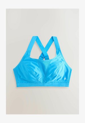Reggiseno sportivo blu realizzato in un tessuto morbido e elastico. Caratterizzato da spalline incrociate, coppe imbottite e un logo triangolare in basso a destra.