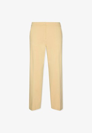 Pantaloni beige su misura con chiusura frontale a bottone e cerniera, gambe dritte e finitura pulita.