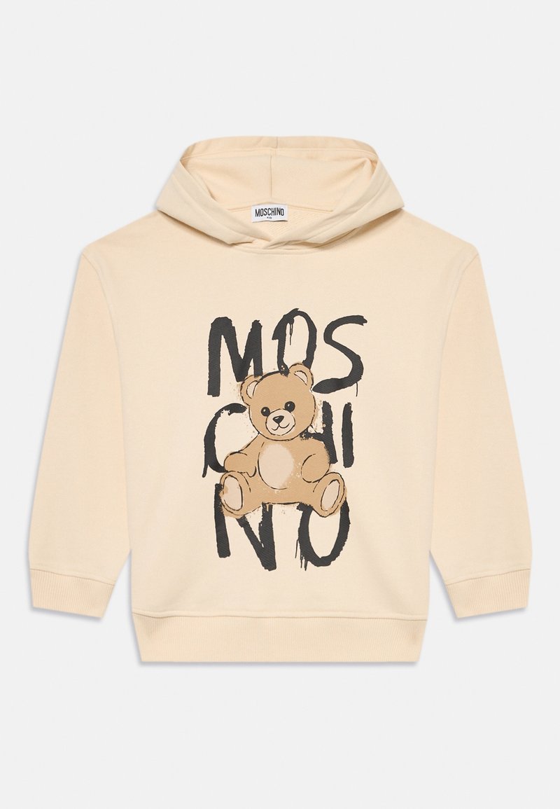Sweat à capuche beige avec une illustration d'ours en peluche et un texte noir dégoulinant indiquant "MOSCHINO" à l'avant.