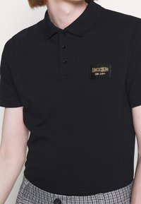 MOSCHINO Piké - black