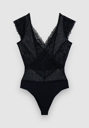 Body noir avec un décolleté en V profond, des accents en dentelle sur les épaules et un bas en tissu lisse. Détails élégants en tissu transparent sur l'ensemble.