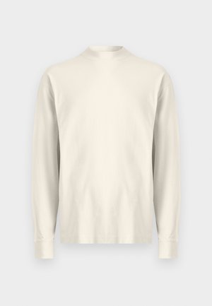 Long-sleeve, mock-neck shirt in light cream cotton. Smooth texture, relaxed fit, minimalist design, no visible patterns or accents.