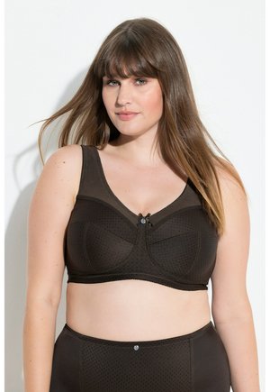 - Biustonosz z trójkątną miseczką