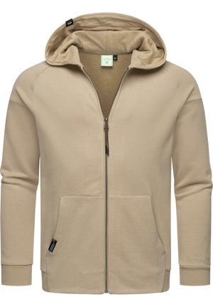 Beige zip-up hoodie gemaakt van zachte, gestructureerde stof. Beschikt over een grote capuchon, twee voorzakken en ribgebreide manchetten. Eenvoudig, minimalistisch ontwerp.