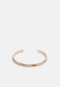 Gold-tone metal cuff bracelet with a textured, diagonal line pattern and smooth edges. Open design for adjustable fit.