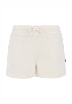 Pantaloni corti in pile beige con elastico in vita e lacci. Presentano una trama morbida e un piccolo logo sul lato.