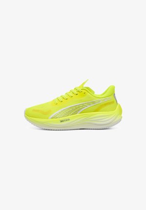 Vibrant neon yellow running shoe with mesh upper, reflective accents, cushioned sole, and sleek design, featuring a lightweight construction.