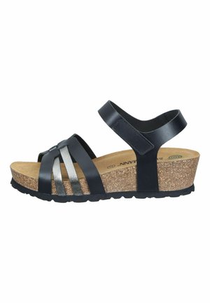 Wedge sandal with cork sole, black leather straps across toes, and adjustable ankle strap with Velcro closure.