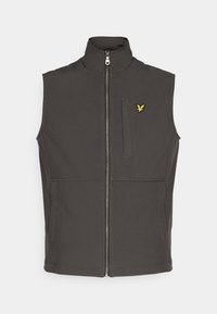 Grå vest med høj krave, frontlynlås, lille brystlomme og gult logodetalje. Fremstillet af glat, let materiale.