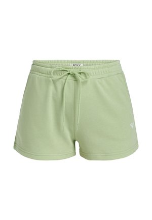 Green cotton shorts with an elastic waistband, drawstring, and side pockets. Features a small white logo on the left leg.