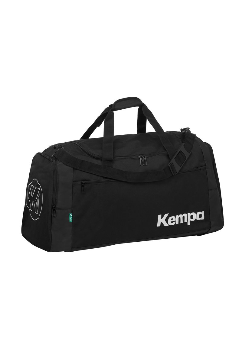Borsa a vento nera con scomparti multipli, dotata di una grande cerniera, tessuto resistente e logo bianco "Kempa" sul lato. Include manici testurizzati.