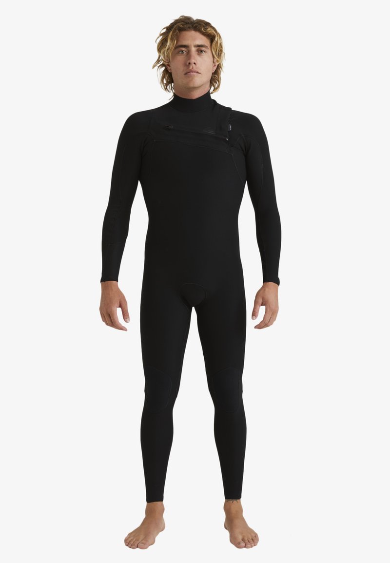 Black wetsuit with long sleeves and full legs. Smooth texture, front zipper, knee pads, and fitted design for water sports.