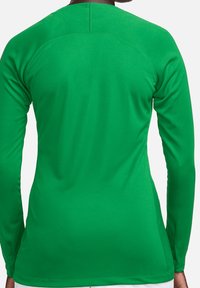 Vihreä pitkähihaisen urheilupaita, joka on valmistettu sileästä, joustavasta kankaasta; siinä on pyöreä kaula-aukko ja istuva siluetti, jossa on minimaalinen saumaus.