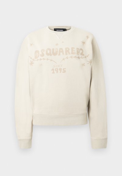 Off-white long-sleeve sweatshirt with DSQUARED2 logo, "since 1995" text, and small star and vine designs across the chest.