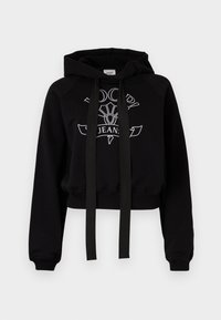 Cropped black hoodie in cotton blend with a kangaroo pocket. Features a hood, black drawstrings, and white logo print on the front.