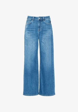 Jeans large en denim bleu clair, à taille haute, avec cinq poches et des détails légèrement déchirés sur le tissu.