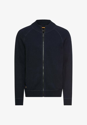 Navy knitted zip-up cardigan with a stand-up collar, ribbed cuffs, and hem, featuring contrast stitching and a small logo on the lower side.