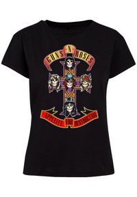 Black cotton t-shirt featuring a colorful graphic of skulls on a cross. Text reads "Guns N' Roses" and "Appetite for Destruction" in bold red.