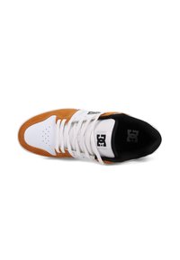 Sneaker with a white leather toe box and brown suede side panels, white laces, black interior, and a logo on the side.