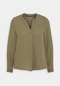 Oliwkowa bluzka z kołnierzykiem w serek, długimi rękawami i gładkiego materiału. Posiada zapięcie z przodu oraz boczne rozcięcia u dołu.